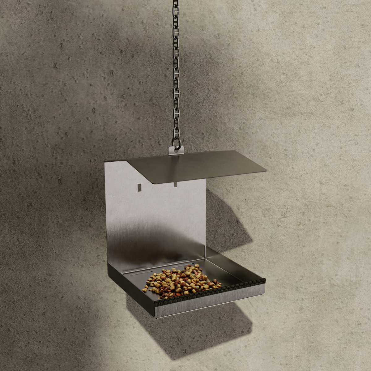 INOX Living Edelstahl Vogelhaus "Helsinki" in silber, aufgehangen an einer Kette vor einer Hauswand, mit Vogelfutter bestückt